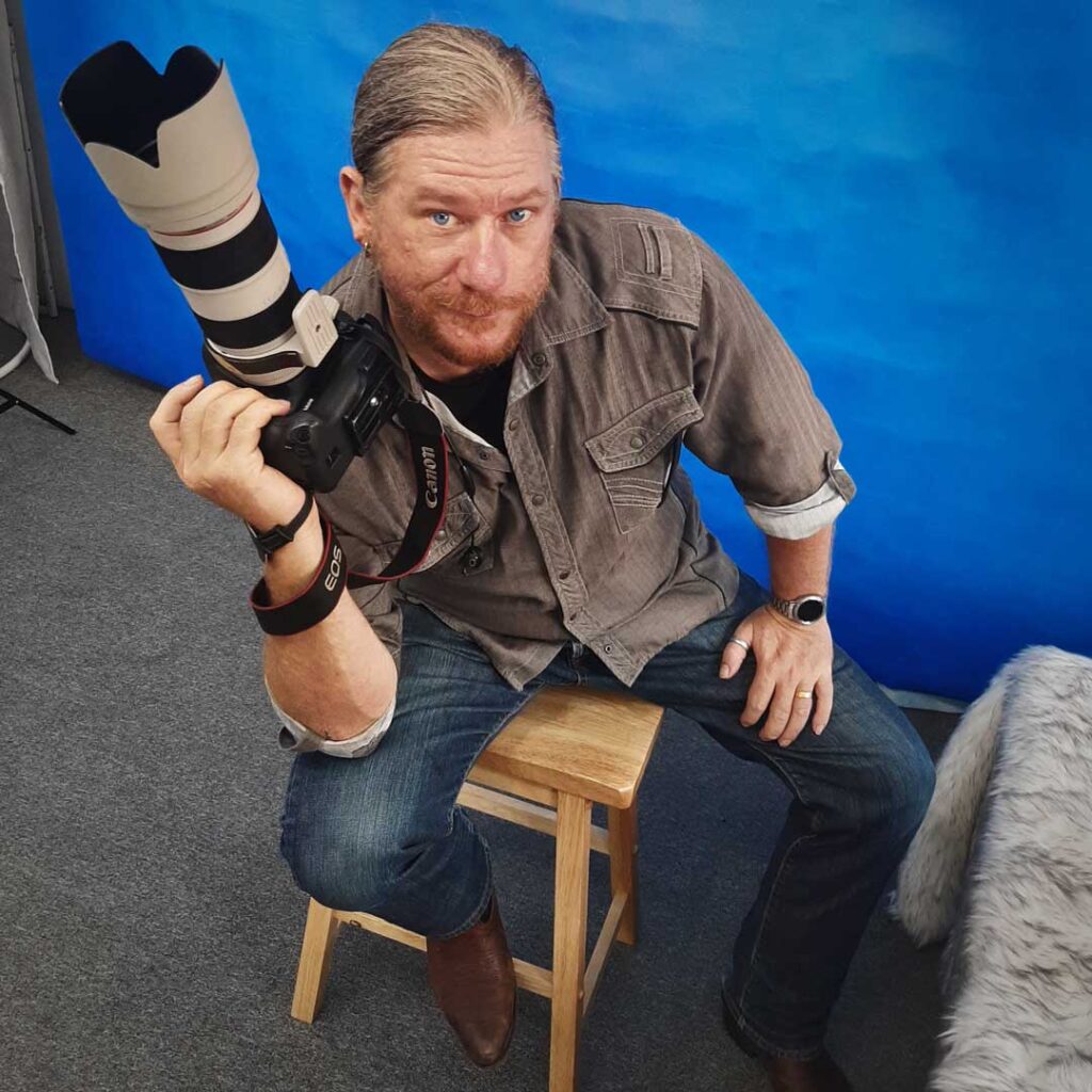 photo of Max holding his Canon camera
